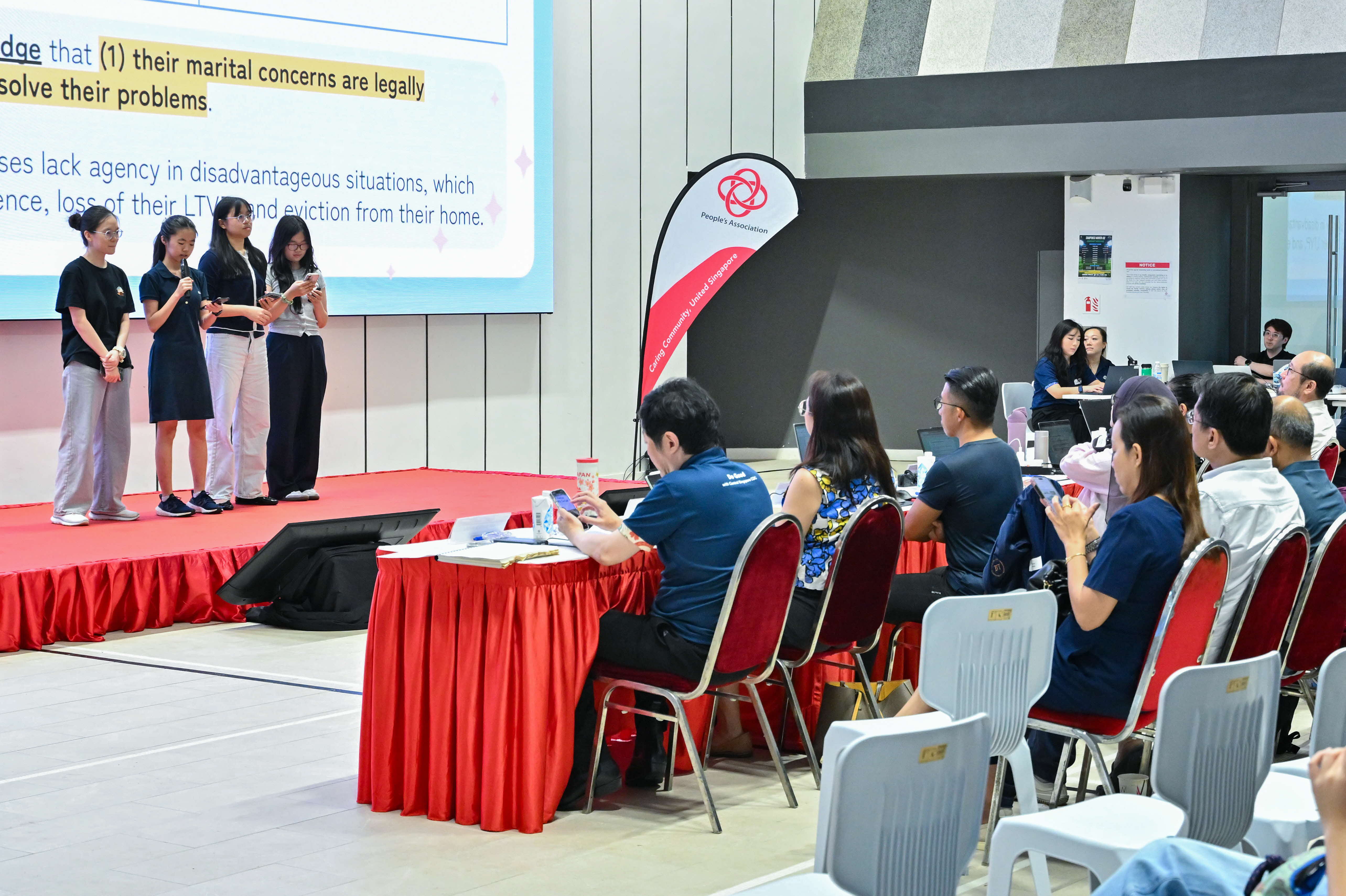 Four students explaining their problem statement to the audience and panel